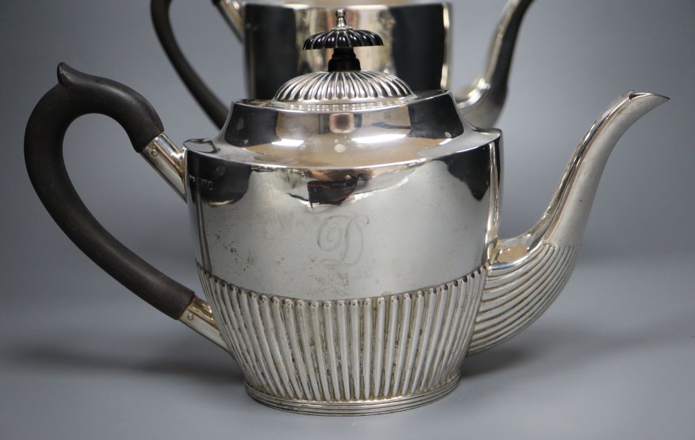 An Edwardian four piece demi-fluted oval silver tea and coffee set, Mappin & Webb, Sheffield, 1902, gross 38oz.
